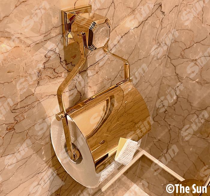 The superyacht features tasteless gold toilet roll holders